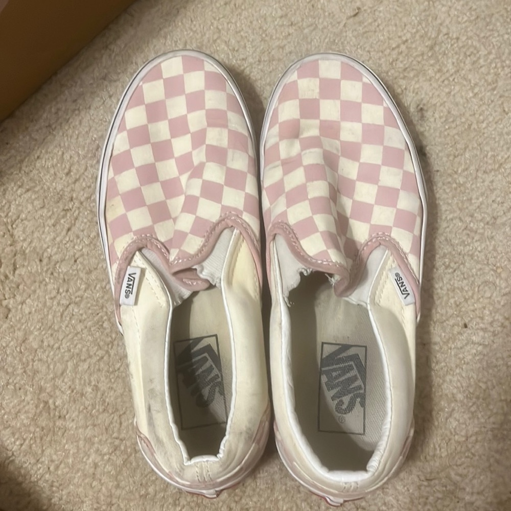 Pink and white vans .